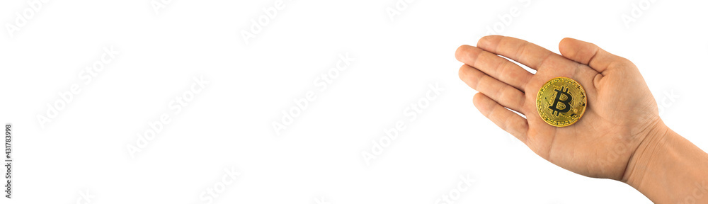 Cryptocurrency bitcoin in hand banner isolated on the white background, copy space, bitcoin coin close-up in male hand