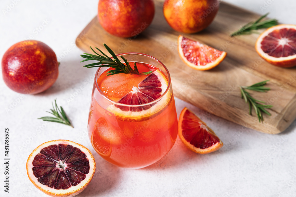 Foto Stock Delicious Blood Orange Cocktail on white table background. Summer  cocktails, lemonade, refreshing drinks, low alcohol mocktail concept. |  Adobe Stock