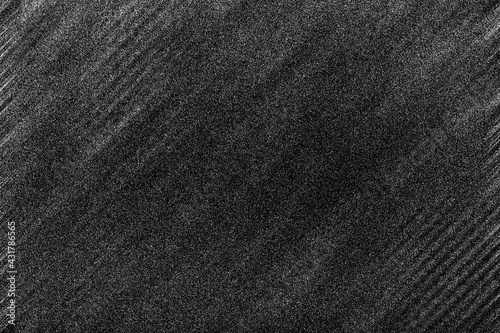 An abstract black and white grainy grunge texture background image.