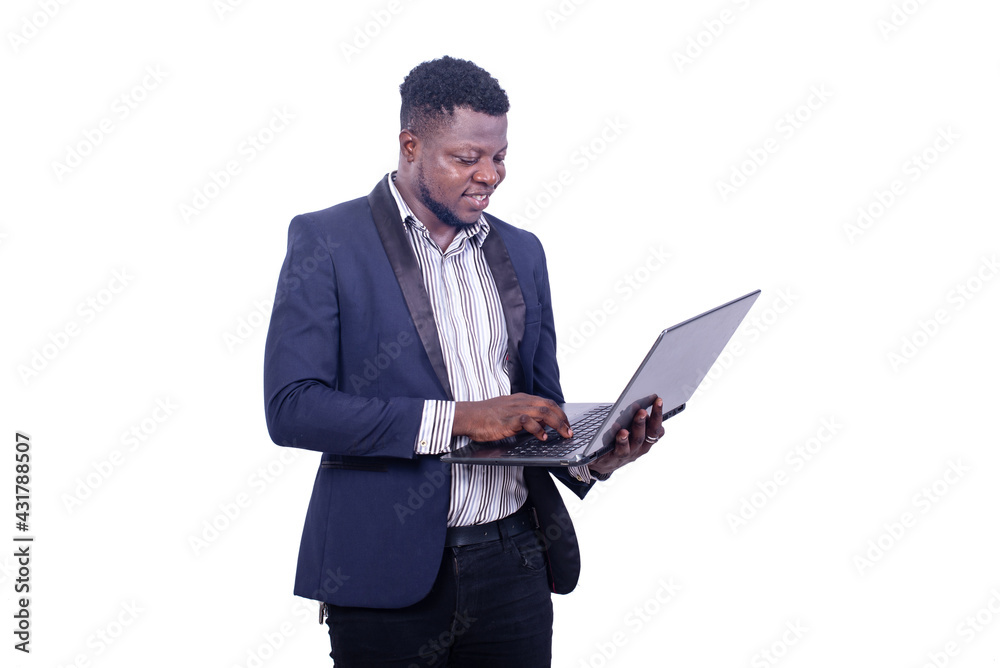 young businessman working on the laptop smiling. young businessman working on the laptop smiling.