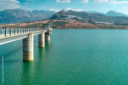 Photograph taken from the road that surrounds the Zahara-El Gastor reservoir and that leads to the beautiful white town of Zahara de la Sierra, located on the foothills of the Sierra del Jaral. photo