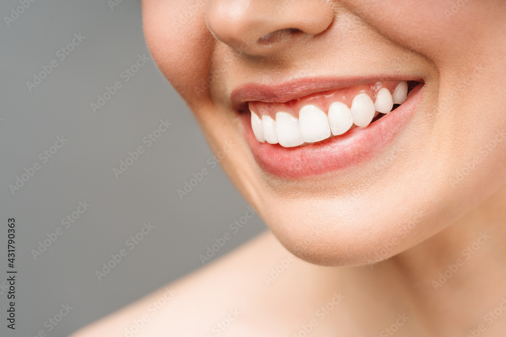 Obraz premium Perfect healthy teeth smile of a young woman. Teeth whitening. Dental clinic patient. Image symbolizes oral care dentistry, stomatology
