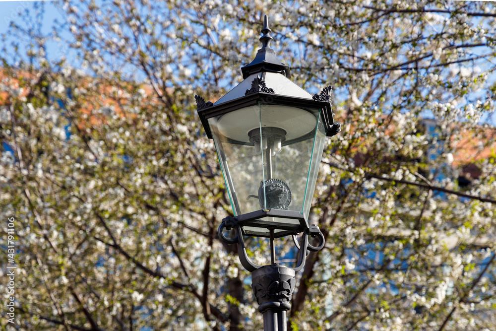 a historic gas lantern converted to electricity in the city of Leipzig