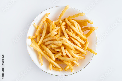 Hot french fries on white background. American unhealthy food