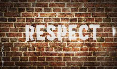 Respect spray painted inscription on the brick wall