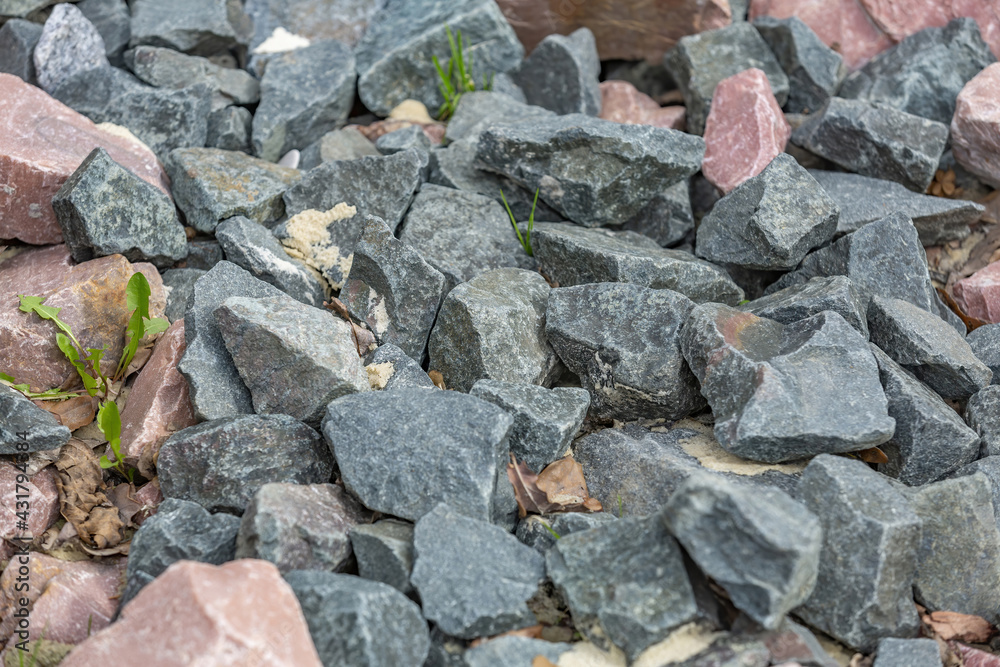 Untreated rough natural stone in everyday environment, gardening and landscaping Untreated rough natural stone in everyday environment, gardening and landscaping