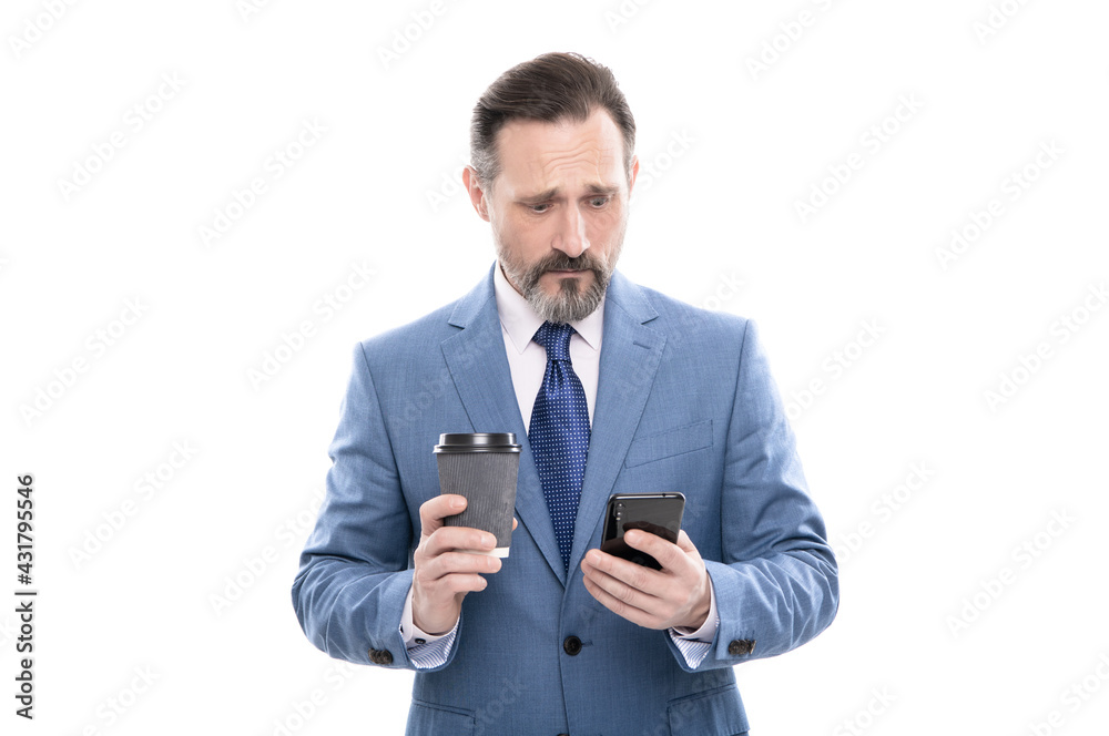 sad mature boss in suit chatting on phone and drink coffee isolated on white, message sad mature boss in suit chatting on phone and drink coffee isolated on white, message