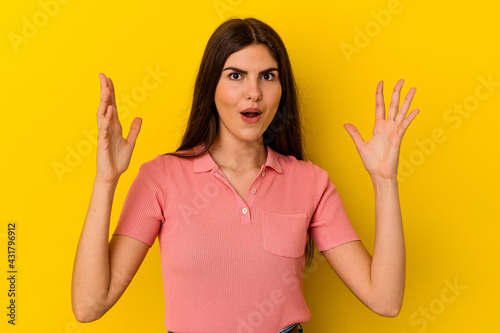 Young caucasian woman isolated on yellow background having an idea, inspiration concept.