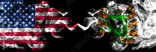 United States of America, America, US, USA, American vs Russia, Russian, Tomsk Oblast smoky mystic flags placed side by side. Thick colored silky abstract smoke flags. photo