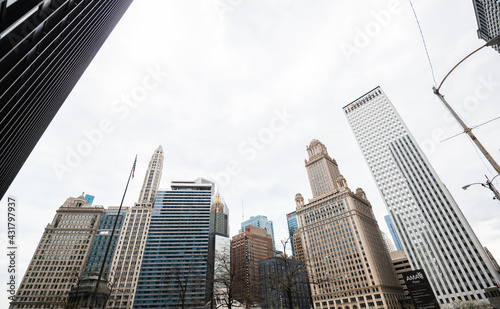 CHICAGO, ILLINOIS - APRIL 18, 2021: Looking up at tall office buildings and skyscrapers in Chicago.