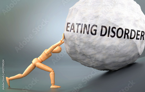 Eating disorder and painful human condition, pictured as a wooden human figure pushing heavy weight to show how hard it can be to deal with Eating disorder in human life, 3d illustration photo