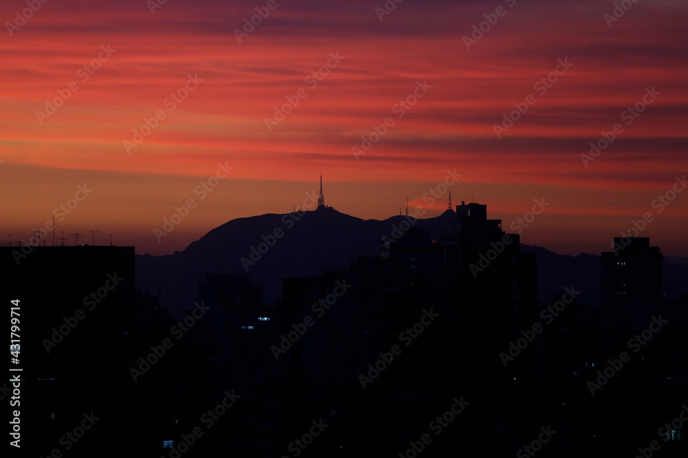 Silhouette of the Jaragua peak and telecommunications antennas are seen in Sao Paulo, Brazil during a beautiful sunset.