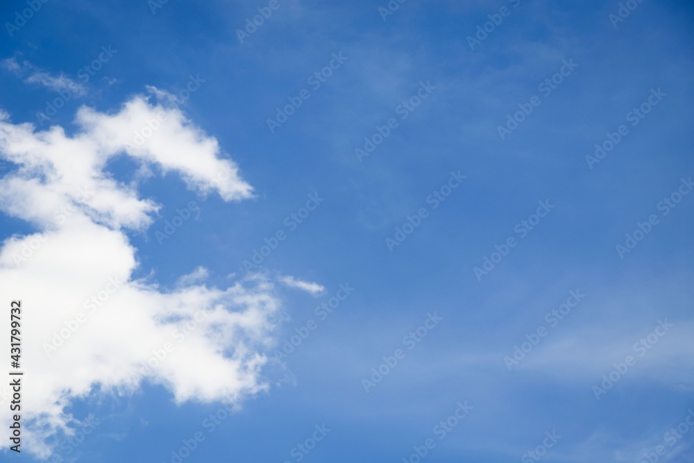 Fototapeta premium White cirro-cumulus clouds against blue sky, free space