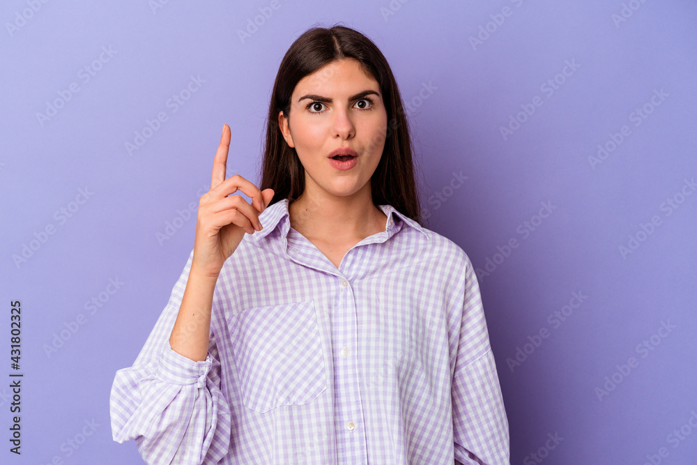 Young caucasian woman isolated on purple background having some great idea, concept of creativity. Young caucasian woman isolated on purple background having some great idea, concept of creativity.