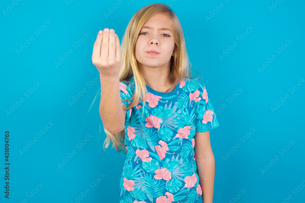 Caucasian kid girl wearing hawaiian T-shirt against blue wall Doing Italian gesture with hand and fingers confident expression Caucasian kid girl wearing hawaiian T-shirt against blue wall Doing Italian gesture with hand and fingers confident expression
