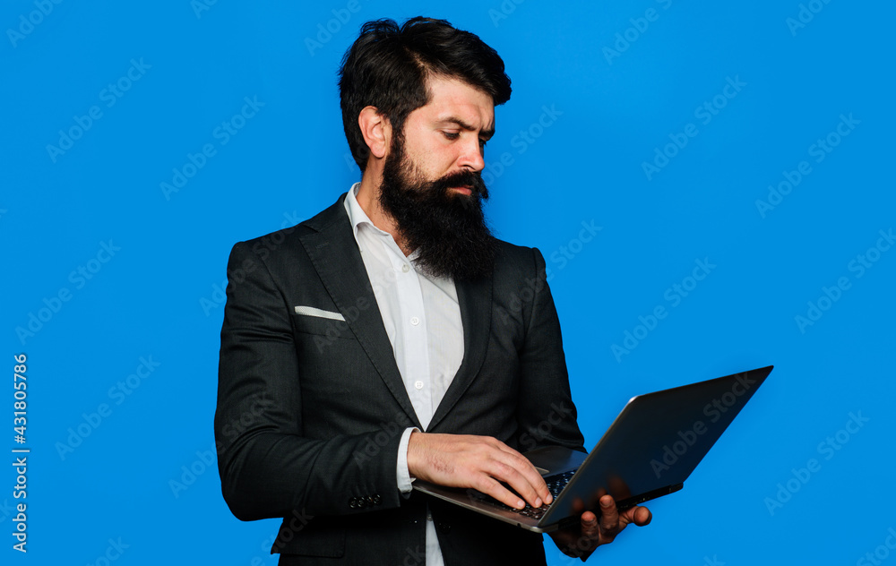 Technology, networking and internet. Businessman with computer at workplace. Serious man with notebook. Business man with laptop. Technology, networking and internet. Businessman with computer at workplace. Serious man with notebook. Business man with laptop.
