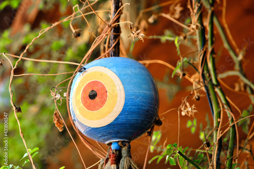 Colorful blue bead worn against the evil eye with square shaped in iznik tile bazaar. photo