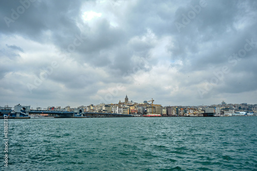 istanbul turkey. Golden horn (halic) photo in istanbul by photo from eminonu district during overcast and rainy day. Architectural details of apartments and galata tower looking bosporus 