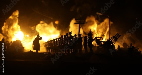 War Concept. Military silhouettes fighting scene on war fog sky background, World War Soldiers Silhouette Below Cloudy Skyline At night. German soldiers in ranks. Selective focus
