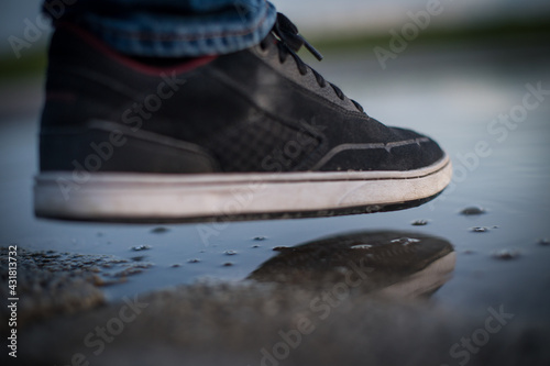 Man steps into a puddle, Shoes will be wet