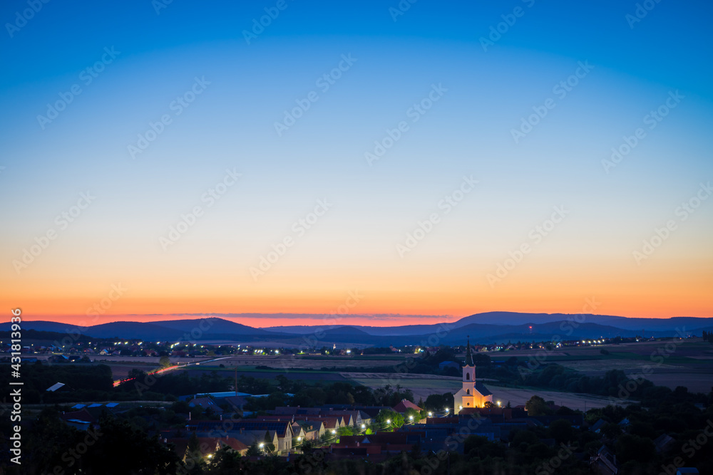 church of Veszpremfajsz at night, illuminated church on transdanubia, Little village near Bakony, sunset at Bakony