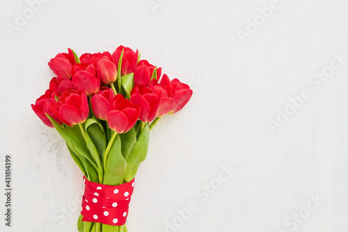 Wallpaper Mural Red tulips bouquet decorated with red ribbon on a light background. Mothers Day, Valentines Day, birthday concept Torontodigital.ca