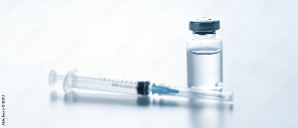 Medical syringe with a needle and a bollte with vaccine. Medical syringe with a needle and a bollte with vaccine.