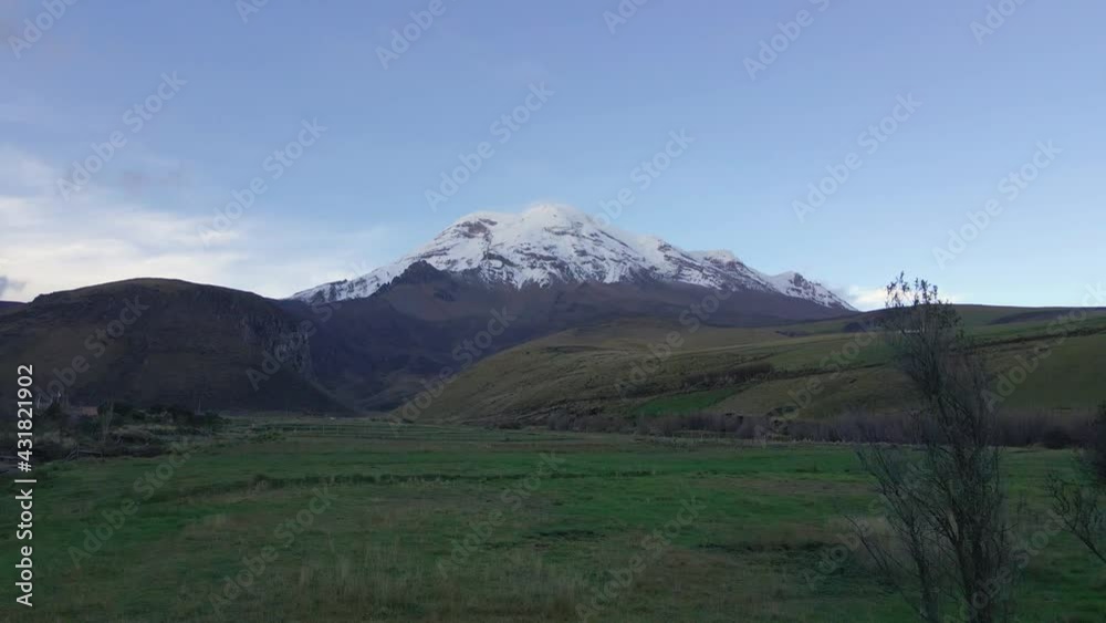 Snow-capped volcano Chimborazo in Ecuador, aerial fly forward view Snow-capped volcano Chimborazo in Ecuador, aerial fly forward view