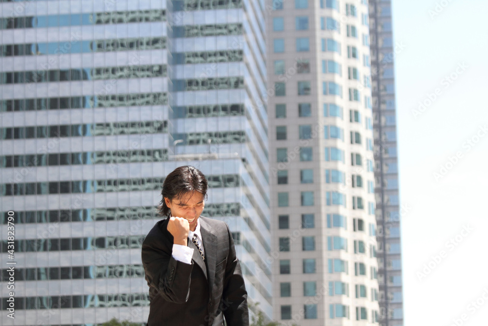 A young Japanese businessman who is happy to work well A young Japanese businessman who is happy to work well