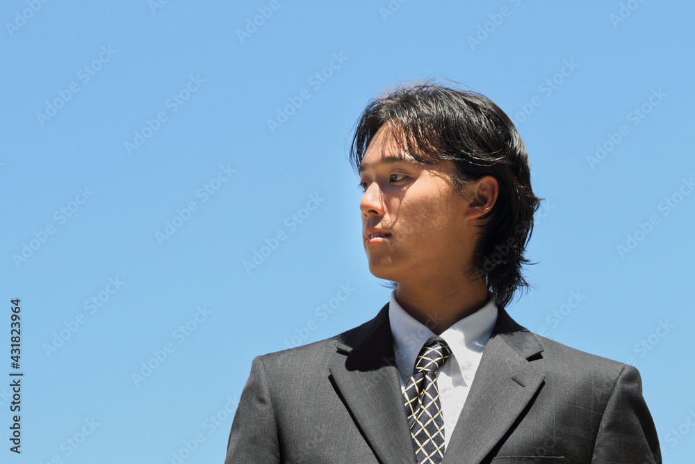 Young Japanese businessman walking in the american business district
Young Japanese businessman walking in the american business district