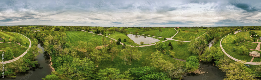 Aerial panorama of horse farms and fields close to the city of Midway, Kentucky