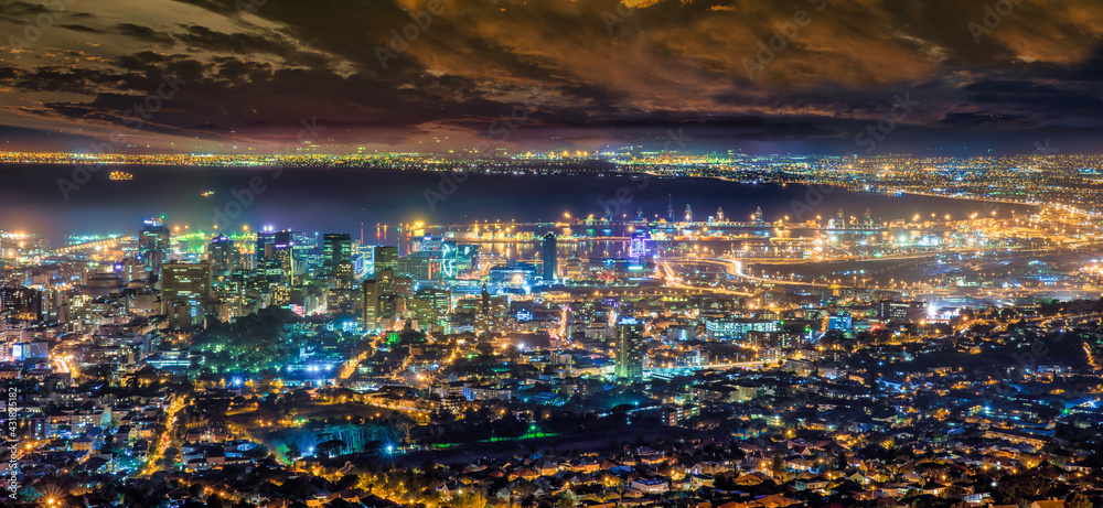 Fototapeta premium Cape Town city and working harbor at night time, South Africa