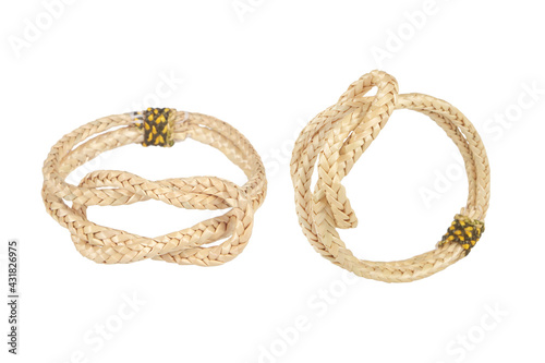 wristband made from woven straw on a white background