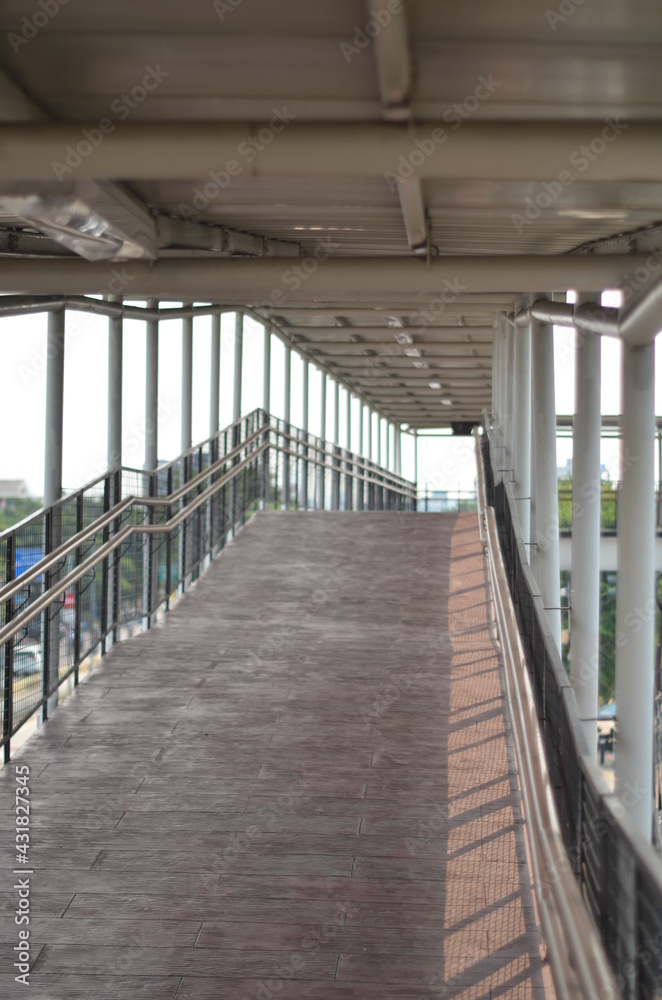 Rawamangun, Jakarta Indonesia, April 23, 2021: A pedestrian flyover structure that connects the busway stop with the LRT station. Rawamangun, Jakarta Indonesia, April 23, 2021: A pedestrian flyover structure that connects the busway stop with the LRT station.