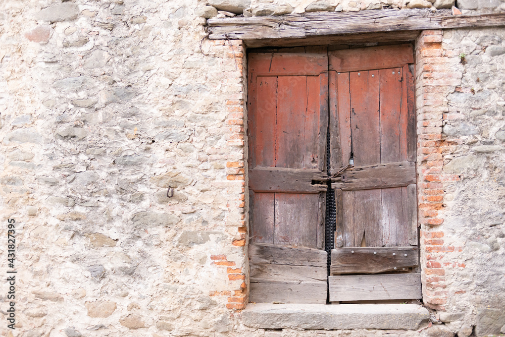 Old wooden door. An old and dilapidated wooden door in an old house in Tuscany. Old wooden door. An old and dilapidated wooden door in an old house in Tuscany.