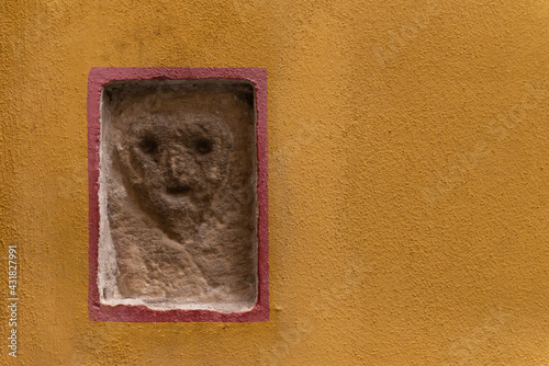 Obraz na plátně Bas-relief on one of the walls of the city of Barga