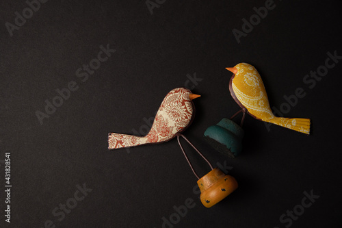 Fotografie Red and Yellow Bird Decorations