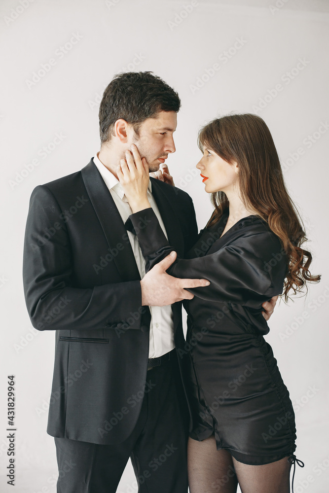 Portrait of young couple in love posing at studio Portrait of young couple in love posing at studio