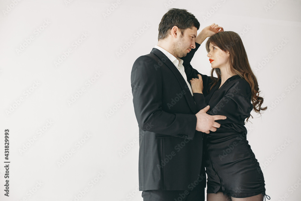 Portrait of young couple in love posing at studio Portrait of young couple in love posing at studio