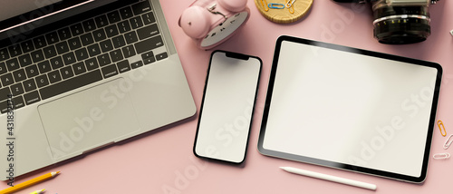 3D rendering, digital tablet and smartphone with mock-up screen on pink pastel background with laptop and supplies