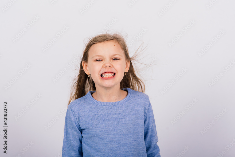 Portrait of beautiful little girl happy smiling on studio. Isolated white background