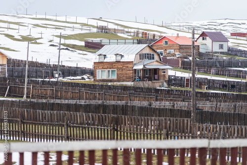 Mongolian house with wooden fences near Erdenet in autumn photo