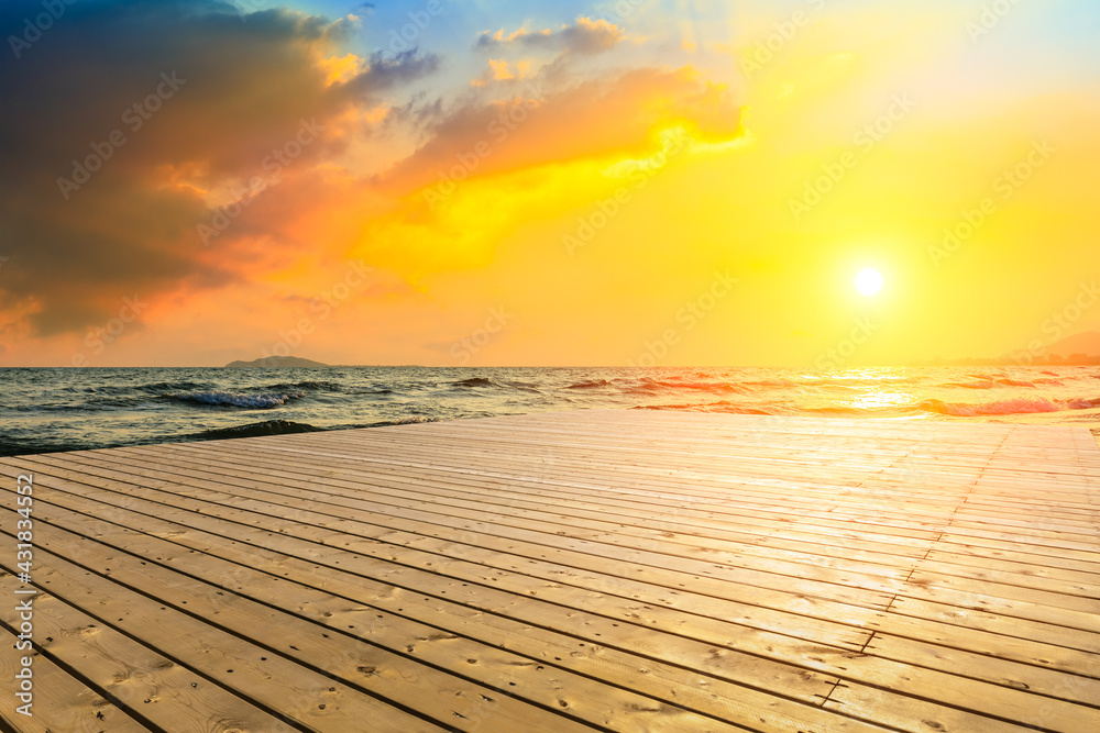 Empty wooden square and sea landscape at sunset.