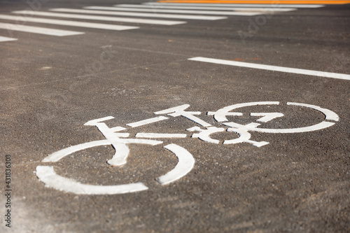 Bicycle lane signage on a street © zhengzaishanchu