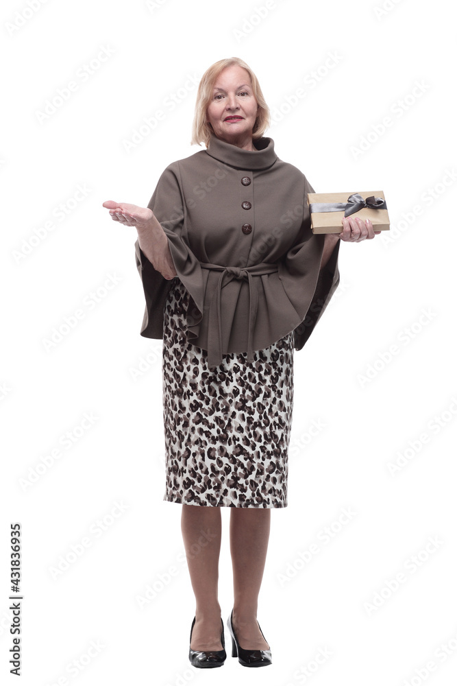 in full growth. attractive mature woman with a gift box. in full growth. attractive mature woman with a gift box.