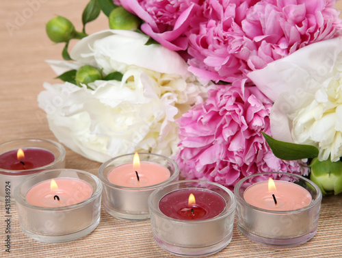 bouquet of peonies and candles