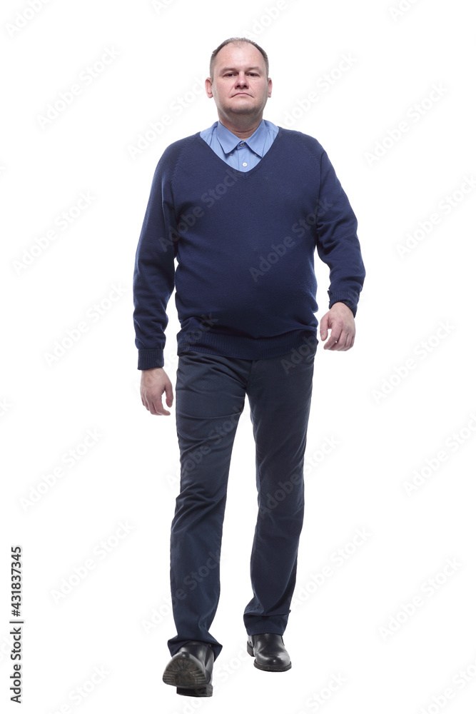 mature man in blue jumper striding forward. mature man in blue jumper striding forward.