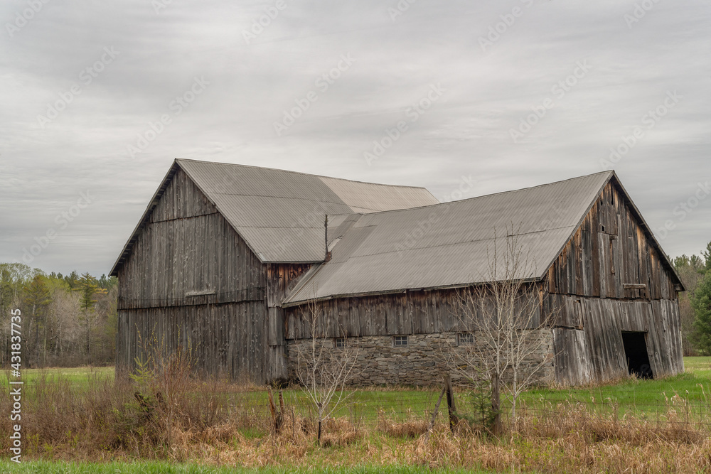 Historical Barn on the farm in early spring on an overcast day