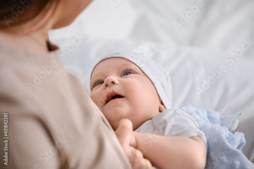 Young woman breastfeeding h...