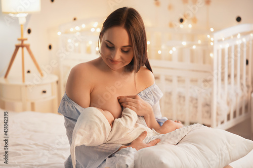 Young woman breastfeeding h...